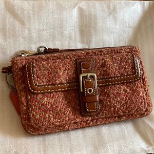 Pink woven coach wristlet